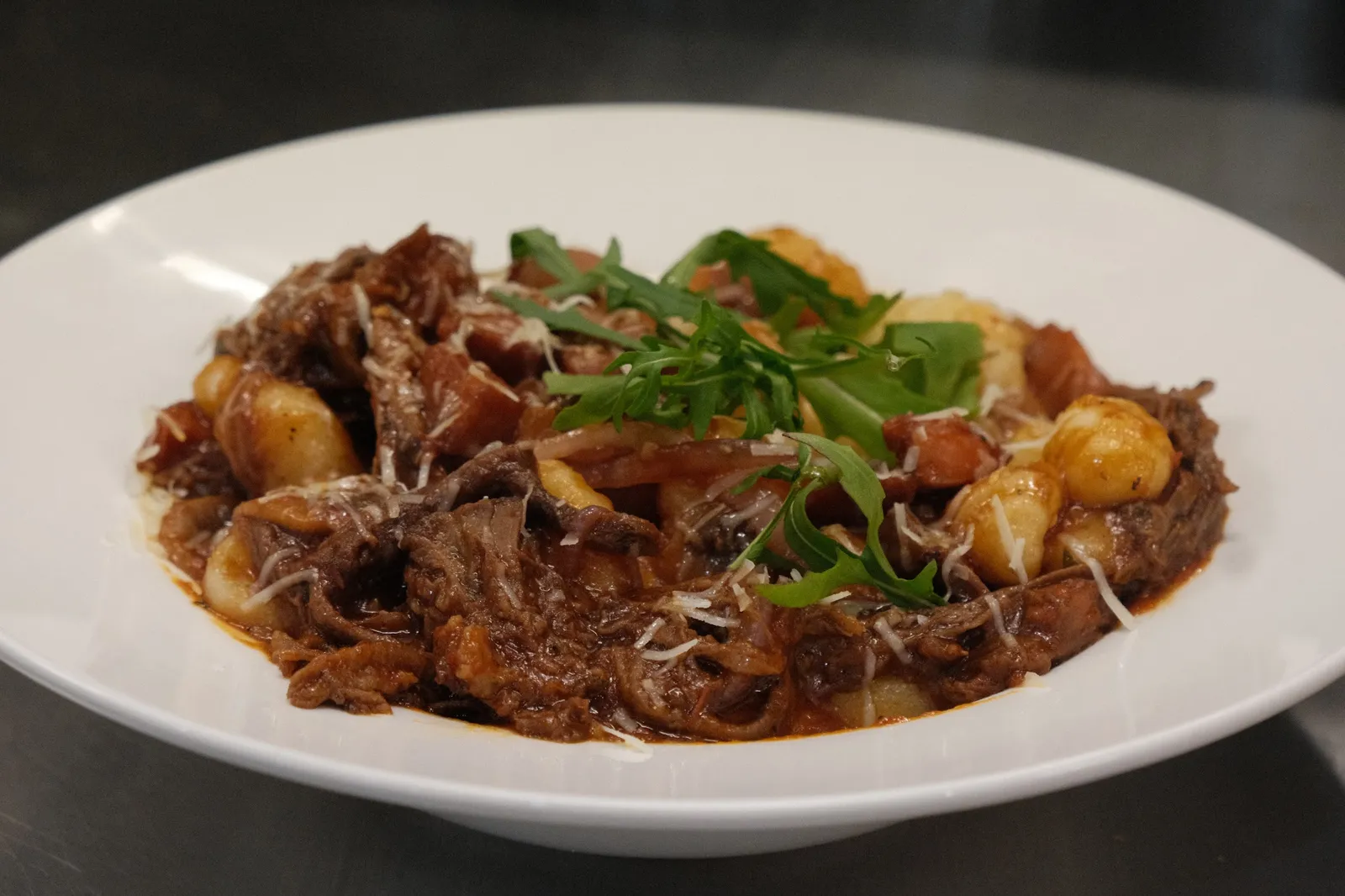 Braised beef gnocchi with parmesan and rocket
