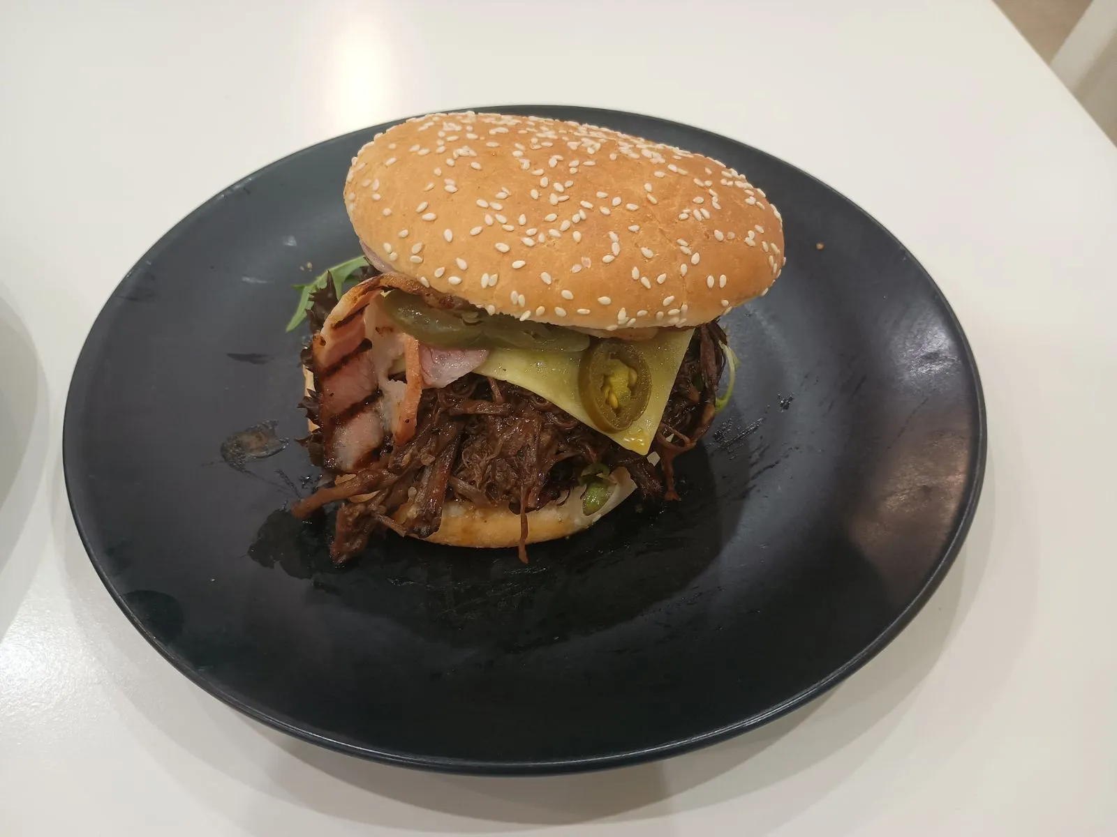 Brisket burger with jalapenos and cheese